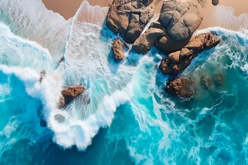 Foto op Plexiglas Sea wave and beach aerial. Foam from a sea wave on the beach. Rocks and sand © Uliana