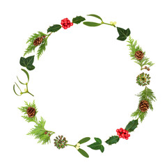 Christmas holly berry and winter greenery wreath on white background. Festive traditional nature...
