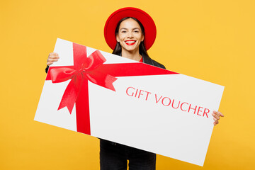 Young woman wear casual clothes red hat hold shopping paper package bags big huge gift certificate...