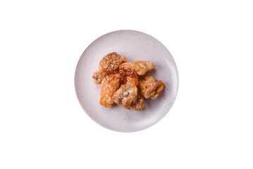 Delicious juicy grilled chicken pieces in sweet and sour sauce with salt and spices
