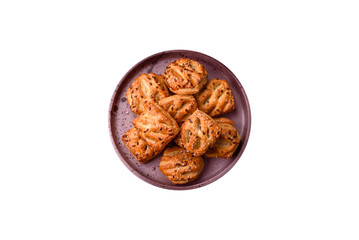 Delicious crispy mini puffs with sausage or meat with salt, thyme and sesame