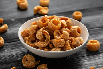 Crispy Pork crackling, scratchings. deep fries in white bowl