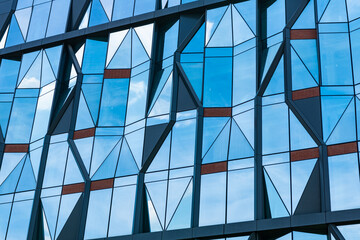 architectural urban backdrop. abstract geometric building. urban design. architectural engineering. exterior facade backdrop. background of architecture. building background of glass windows