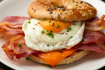 Bagel sandwich with bacon, egg and cheese. Breakfast