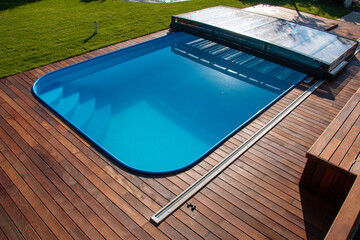 Ipe Wood deck around the pool high angle view, beautiful Ipe hardwood decking around swimming pool...