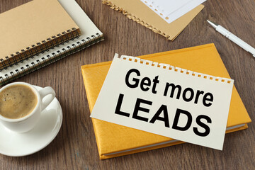 Get More Leads beautiful yellow notepad on the work table. text on the page