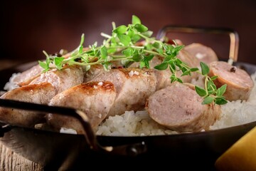 4K Image: Grilled Sausage Served Over Steaming White Rice, a Mouthwatering Dish