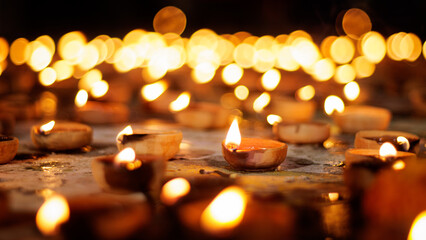 Diwali, Hindu festival of lights celebration. Clay diya candles illuminated in Dipavali,...