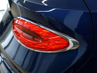 Expensive sports car concept. Modern luxury car, detail on one of the LED taillights modern car