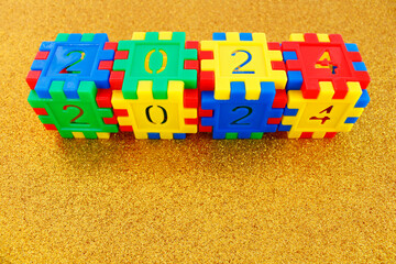 Year 2024, colorful puzzle cubes with numbers