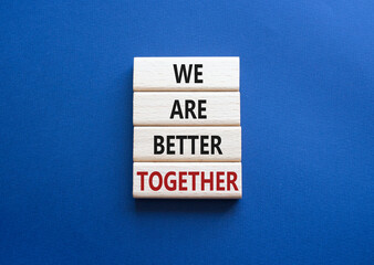 We are stronger together symbol. Wooden blocks with words We are stronger together. Beautiful deep blue background. We are stronger together concept. Copy space.