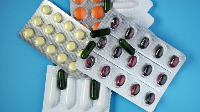 Tablets, pills and rectal suppositories for the treatment of prostate adenoma, frequent urination and erectile dysfunction. 4K video, rotating.