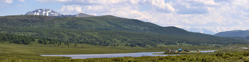 buildings near lake in Altai mountains