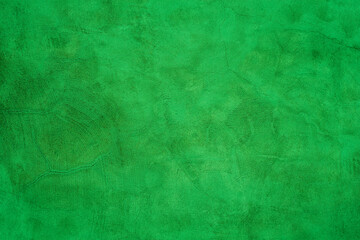A green colored old cement wall texture background.