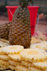 Pineapple slice at street fruit stall