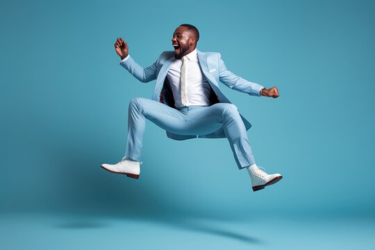 Businessman wearing suit dancing jumping