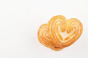 Heart shape biscuit on white background