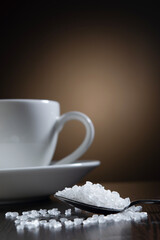 Closeup of sugar spoon at table