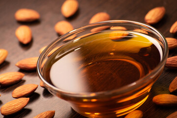 Almond with oil bowl at table