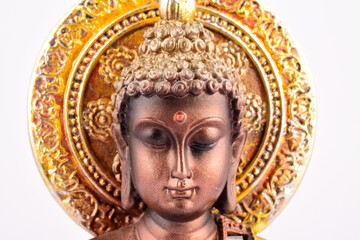 Closeup of buddha face isolated on white background