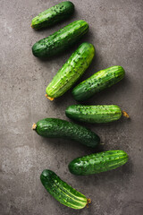 Fresh cucumbers on dark background.