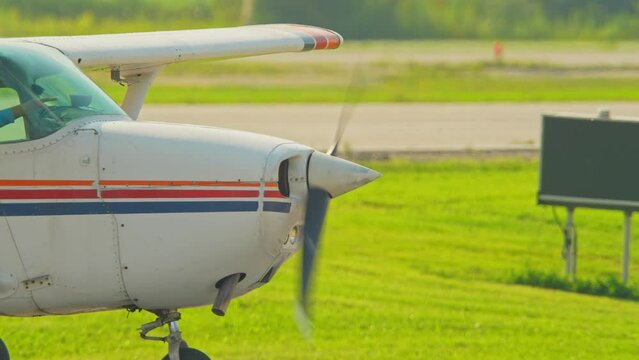 Flying pilot lessons and flight training for recreational pilot permit. Plane engine with working propeller. Departure warm up of a small aircraft. Private single engine airplane at Municipal Airport.