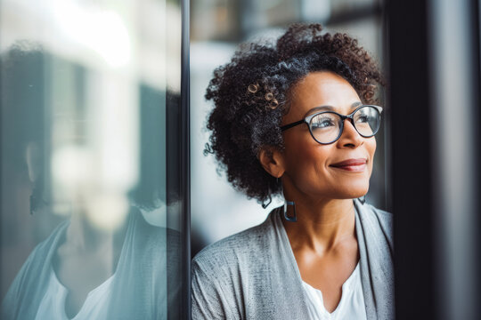 Successful Mature Afro American Woman At Meeting In Office. Mature Confident Black Business Woman In Business Environment Building.