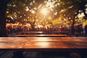 A vibrant bohemian-style wooden table situated within a lively music festival, with the energetic crowd of festival-goers and the vibrant stage lights forming an electric ambiance - obrazy, fototapety, plakaty