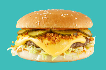 hamburger like in McDonald's with a beef cutlet on a green background, studio shooting