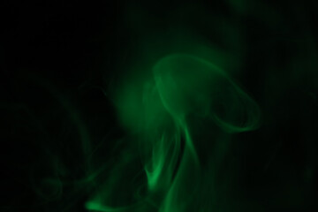 Green lines, green smoke on a dark background, colourful abstract, green fog, minimalism, line of...