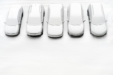 Cover winter parking lot cars under snow covered cars winter season. Snowy row of cars snow background winter time. Top view. Cold weather. Snowbound, Snow weather conditions. Above view. White design - obrazy, fototapety, plakaty