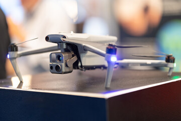 Fototapeta na wymiar Drone with blue lights in flight.