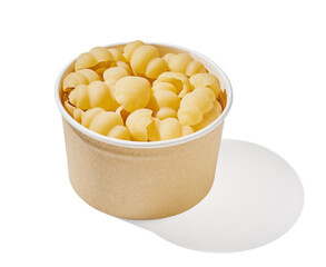 Colorful pasta conchigliei noodle in wooden bowl isolated on white, close up