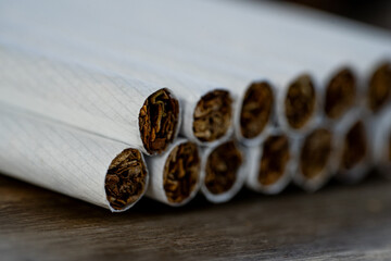 Macro cigarettes on the wooden table bokeh