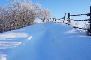 Snowdrifts in the countryside.Frosty winter damp atmosphere.