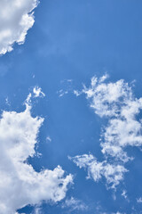 clouds in the blue sky in summer over the black sea beach