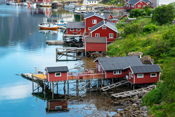 Reine, fishing village with red rorbu cottages, Lofoten islands, Norway. The Norwegian fishing hut...