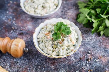 A bowl of traditional russian salad olivier.