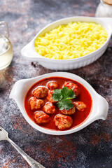 Chicken meatballs with tomato sauce.