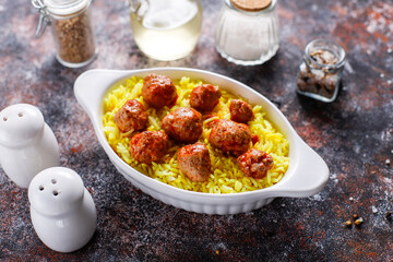 Chicken meatballs with tomato sauce.