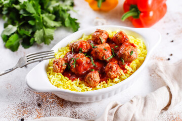 Chicken meatballs with tomato sauce.