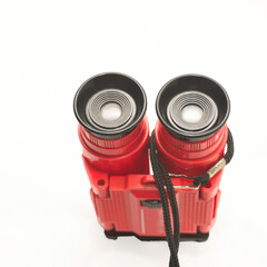 Toy binoculars on a white background