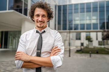 portrait of one caucasian adult man stand outdoor wear white shirt