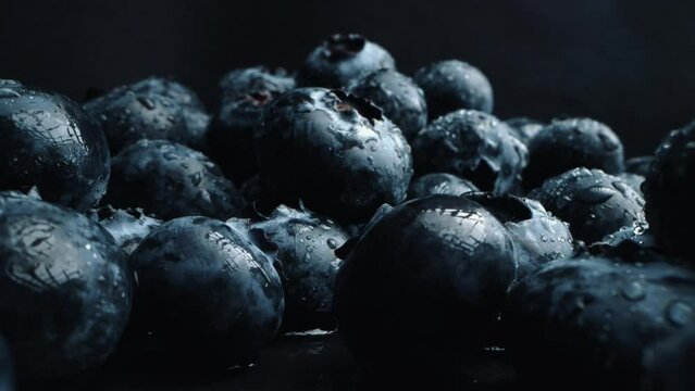 Fresh juicy blueberries in macro. Close up of bilberries. ProRes 4K