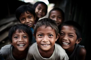 Fotobehang Group of Indonesian children laughing and smiling in a village. © Sentinello