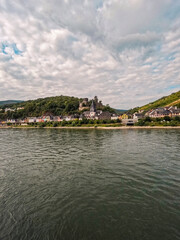 Fototapeta na wymiar Scenic Views of the Quaint German Village of Niederheimbach as Viewed from the Rhine River. Colorful European style architecture.