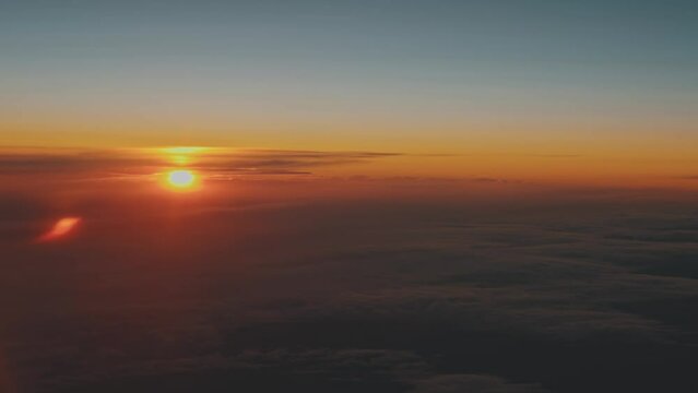 Bright orange sun on the horizon at dawn