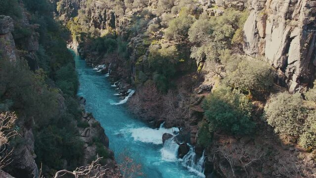 Mountain blue stream flows in gorge