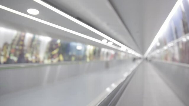 Moving blurred walkway in airport