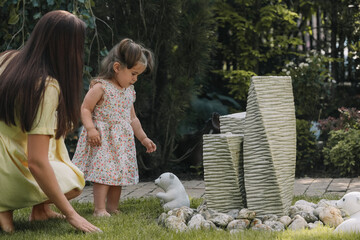 Fototapeta premium Mother with her cute daughter spending time together in park